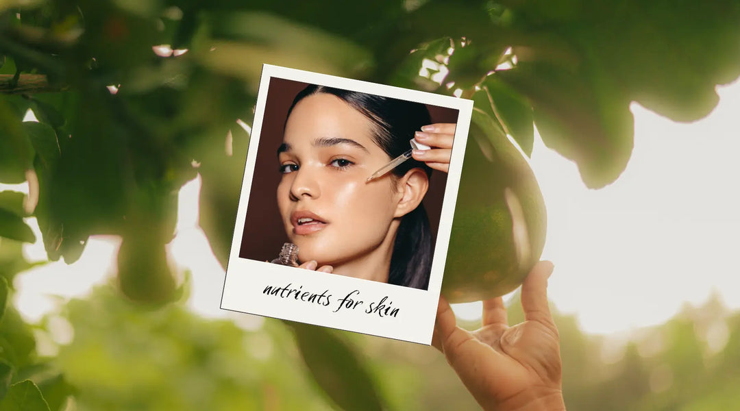 Model applying a skincare serum, emphasizing skin-loving nutrients in a nature-inspired setting with fresh green fruits. Available at VAMS Beauty, offering nutrient-rich, natural skincare products.