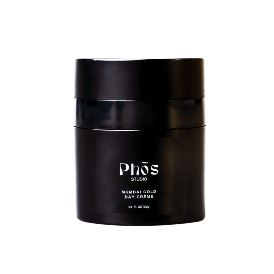 Phōs Studio Mumbai Gold Day Crème in a sleek black container, isolated on a white background, showcasing the elegant and minimalist design of the packaging.