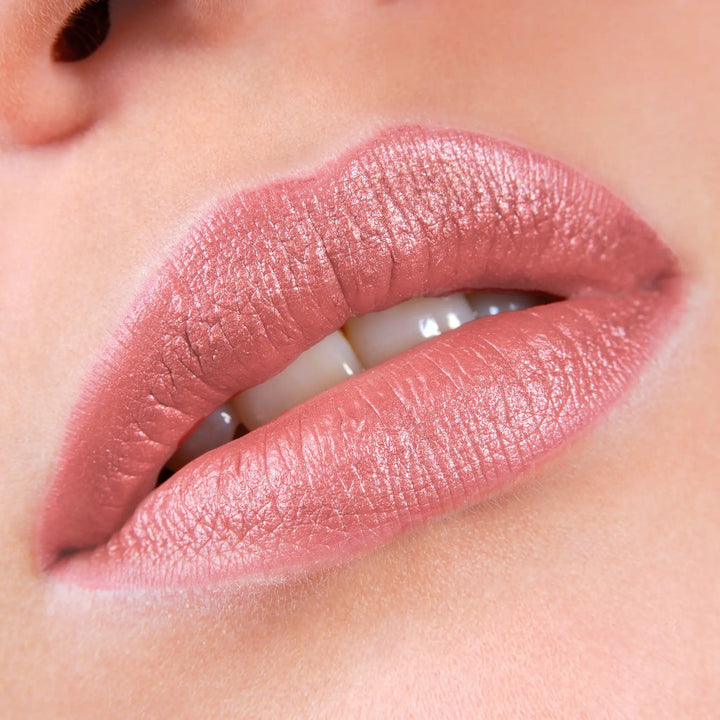 Close-up of lips wearing Avocado Zinc SPF 50 Natural Lip & Cheek Tint in Berry, available at VAMS Beauty. This Australian-made tint provides broad-spectrum sun protection and a natural, rosy hue, perfect for enhancing lip color with a moisturizing and protective formula.