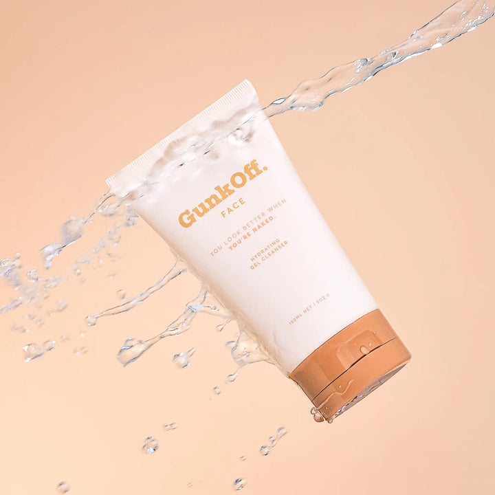 Refreshing splash of water enveloping the GunkOff Hydrating Gel Cleanser, highlighting its soothing and gentle formula. An Australian-made skincare essential for hydration and sensitive skin care.