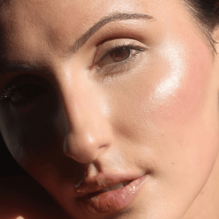 Glowing skin with a dewy glow, achieved using VAN-IT Liquid Radiance Highlighter, an Australian beauty product for luminous skin. Available at VAMS Beauty.