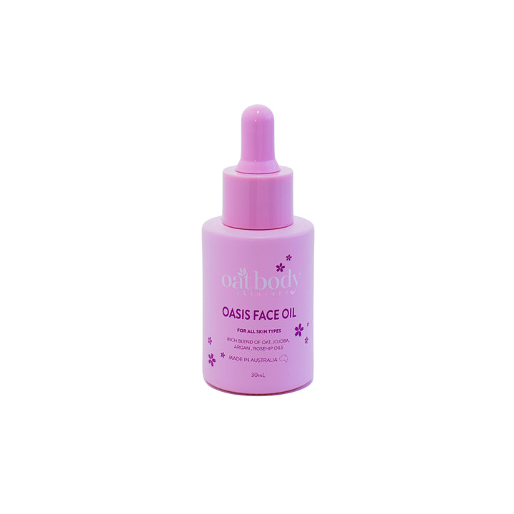 Face Oil in a pink dropper bottle, featuring a rich blend of oat, jojoba, argan, and rosehip oils, designed for all skin types and made in Australia.