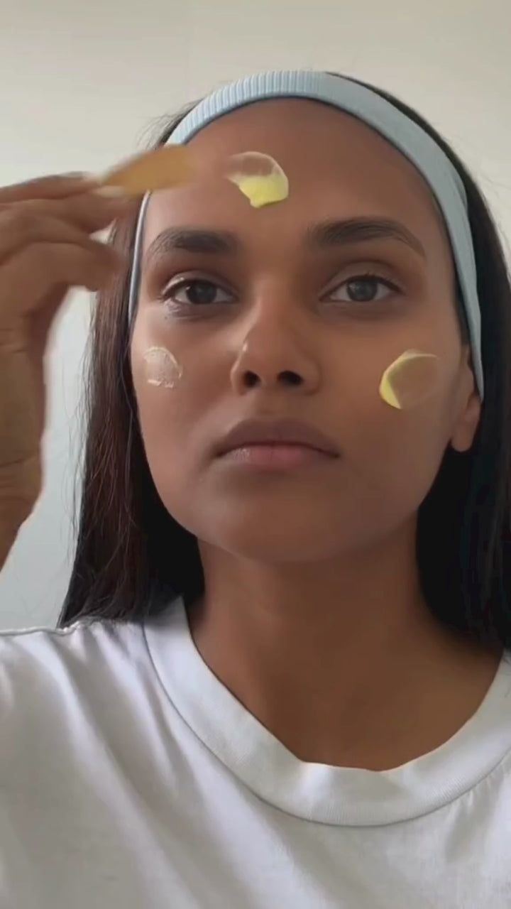 Woman applying Phos Studio Ayurvedic skincare products made in Australia, a nourishing Ayurvedic skincare product for dry skin, available at VAMS Beauty.