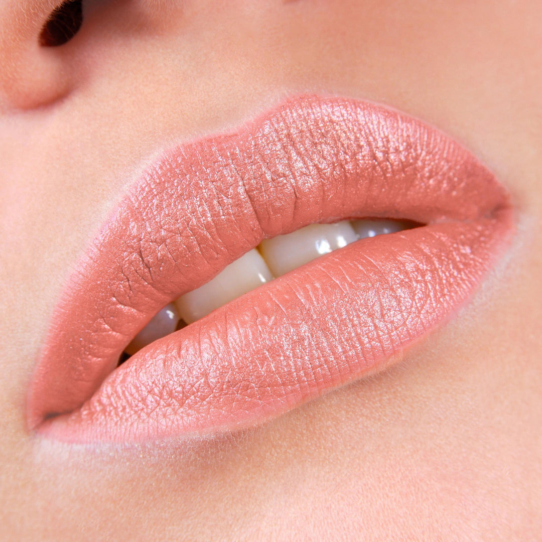 Close-up of lips wearing Avocado Zinc SPF 50 Natural Lip & Cheek Tint in Coral, available at VAMS Beauty. This Australian-made tint offers broad-spectrum sun protection and a natural, rosy hue, perfect for enhancing lip color with a moisturizing, protective formula.