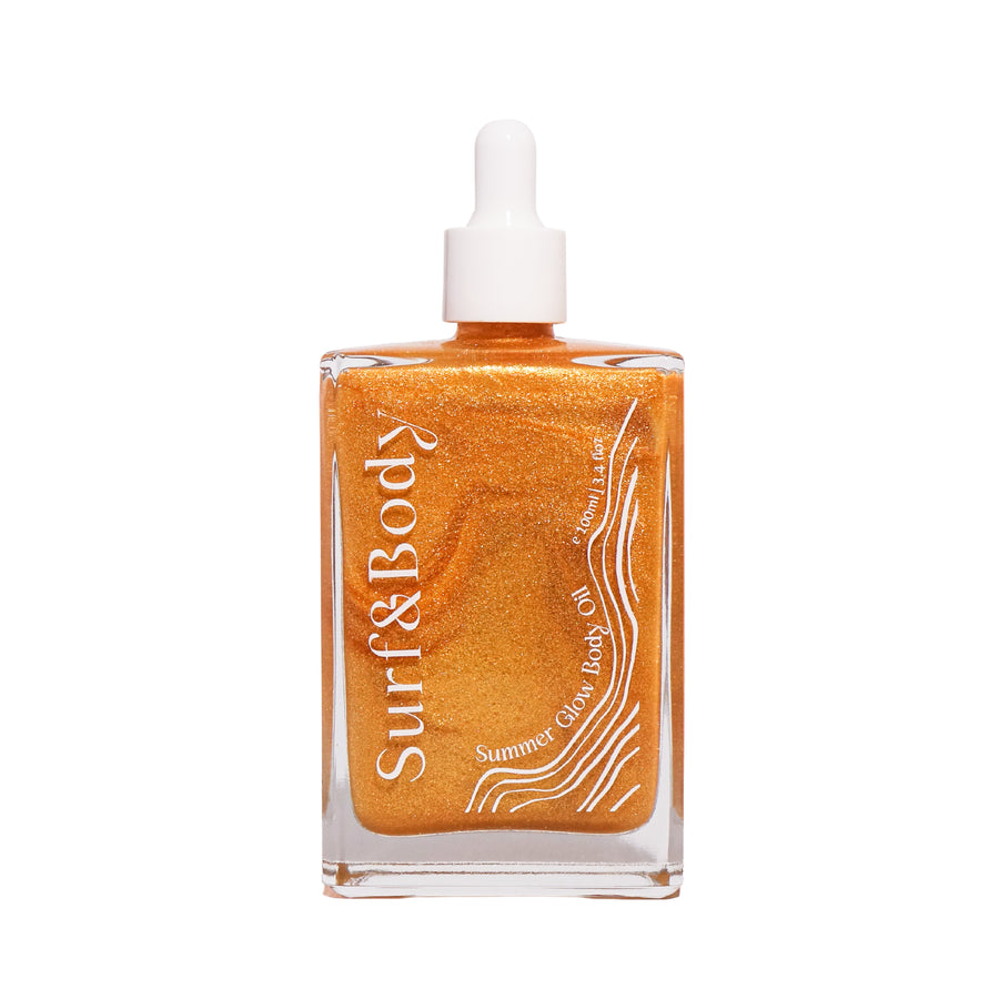 Surf & Body Summer Glow Body Oil in a clear glass bottle, featuring a shimmering golden formula designed to hydrate and enhance the skin with a radiant, sun-kissed glow.