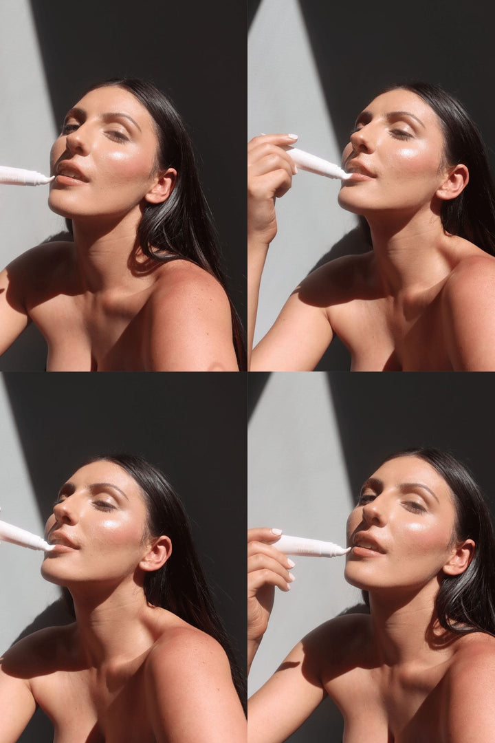 Model applying Vani-T Lip Glaze Sheer Gloss in natural sunlight, showcasing a radiant, glossy finish for full, hydrated lips. Inspired by Rhode Beauty lip gloss dupe